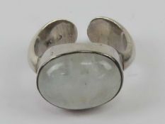 A silver moonstone ring, large central o