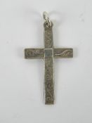A silver crucifix pendant having scrolli
