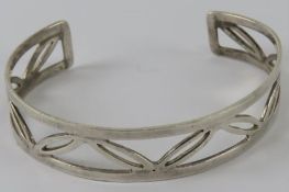 A HM silver bangle having open leaf patt