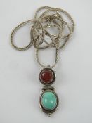 A carnelian and turquoise pendant, no ap
