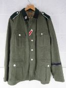 A reproduction WWII German SS Battle Tunic size XL.