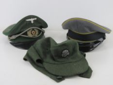A quantity of reproduction militaria; 1x WWII German Officers Cap, slight damage to visor.