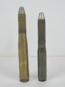 Two inert German 20mm shells, having marks upon.