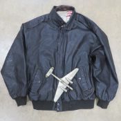 A WWII type USA leather Bomber jacket size large. Together with a cast metal model of B24 Liberator.