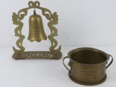 A Trench Art bell together with a Trench Art bowl.