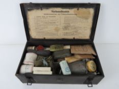 A WWII German Vehicle First Aid Kit with contents.