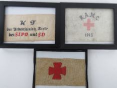 Three framed arm bands.