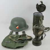 A quantity of reproduction German military items inc; helmet, bread bags, gas mask,