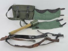 1x German 'Y' straps. 1x Replica German 'Potatoe Masher' grenade. 1x pair of German Gaiters.