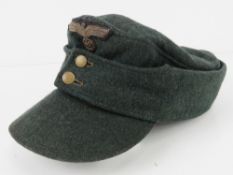 A reproduction WWII M43 cap..