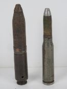 An inert German 20mm shell, together with an inert German 30mm shell having marks upon.