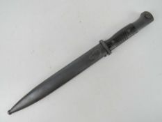 A Yugoslavian Mauser bayonet with scabbard, numbered 2161 and W.K.G.