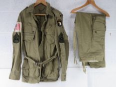 An WWII American Airborne Jump jacket Badged to 101st airborne, size 48R.