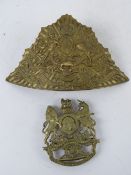 A Royal Artillery helmet plate together with a 17th Lancers helmet plate. Two items.