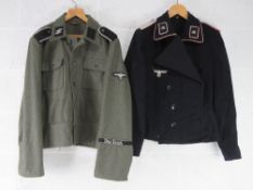 A replica German SS Panzer tunic. Size 41 together with a replica German Combat Tunic Size XXXL.