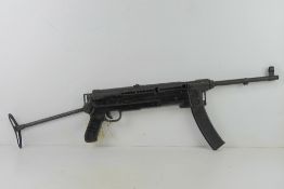 A deactivated M56 Sub Machine gun. SN 5857A.