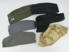 Six assorted contemporary caps and berets.