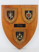 A presentation Plaque for Royal Corp of Transport having three small plaques attached.