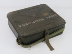 A WWII German Medic Gas Cape tin.