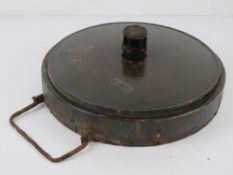 An inert WWII German Teller Anti Tank mine, dated 1939, with fuse but no base.