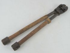 A pair of WWII German wire cutters with Bakelite end caps.