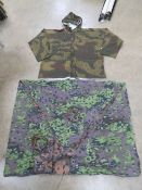 A reproduction WWII German Army Parka, size XXL. With repro Zeltbahn and straps.