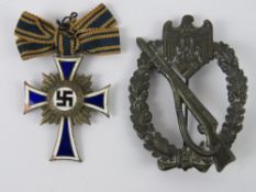 A WWII German Assault badge, together with a Mothers Cross.