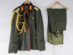 A reproduction WWII German General's tunic (XXXL) with breeches (XL).