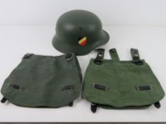 A German helmet together with two German bread bags.