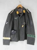 A reproduction WWII German Luftwaffe Tunic with insignia and side cap (size 58).