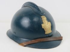 A French Adrian Helmet with liner and strap.