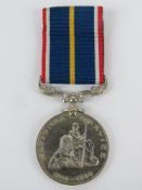 A boxed National Service Medal and ribbon 1939-1960.