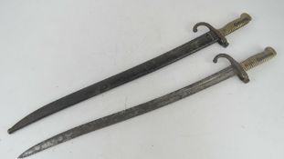 Two Chassepot bayonets, one with scabbard.