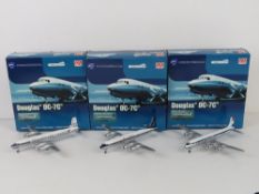 Three Douglas DC-7C 1;200 scale die cast