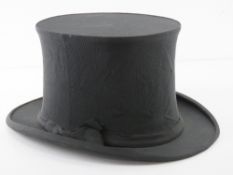 A vintage collapsible top hat by Austin Reed Regent Street, approx size 6.75.