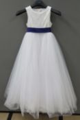 A flower girl dress with purple sash and tulle skirt by David Bridal, age 8.