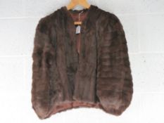 A vintage faux fur shrug, slight damage to left shoulder noted.