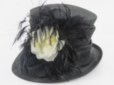 A Victoria Ann natural fibre hat having