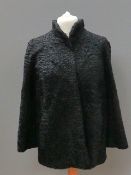 A black curly Persian lambs wool jacket, approx measurements - 43