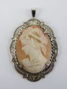 A HM silver pendant having carved shell