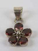 A silver floral cluster pendant, red col