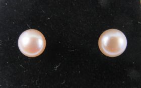 A pair of 9ct and pale pink pearl earrin