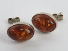 A pair of silver and Baltic amber stud e