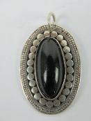 An onyx pendant , stamped 925 and measur