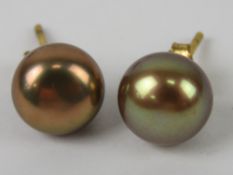 A pair of 9ct gold and coloured pearl st