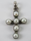 A silver and pearl crucifix pendant, sta