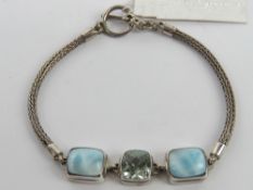 A silver and hardstone bracelet having T