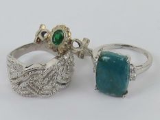 Three silver rings size R-T, one with tu