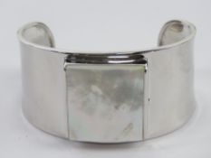 A HM silver and mother of pearl bangle,