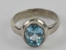 A contemporary silver and blue stone rin